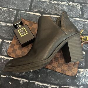 Dolcetta black ankle boots with snake detail, and side cut out